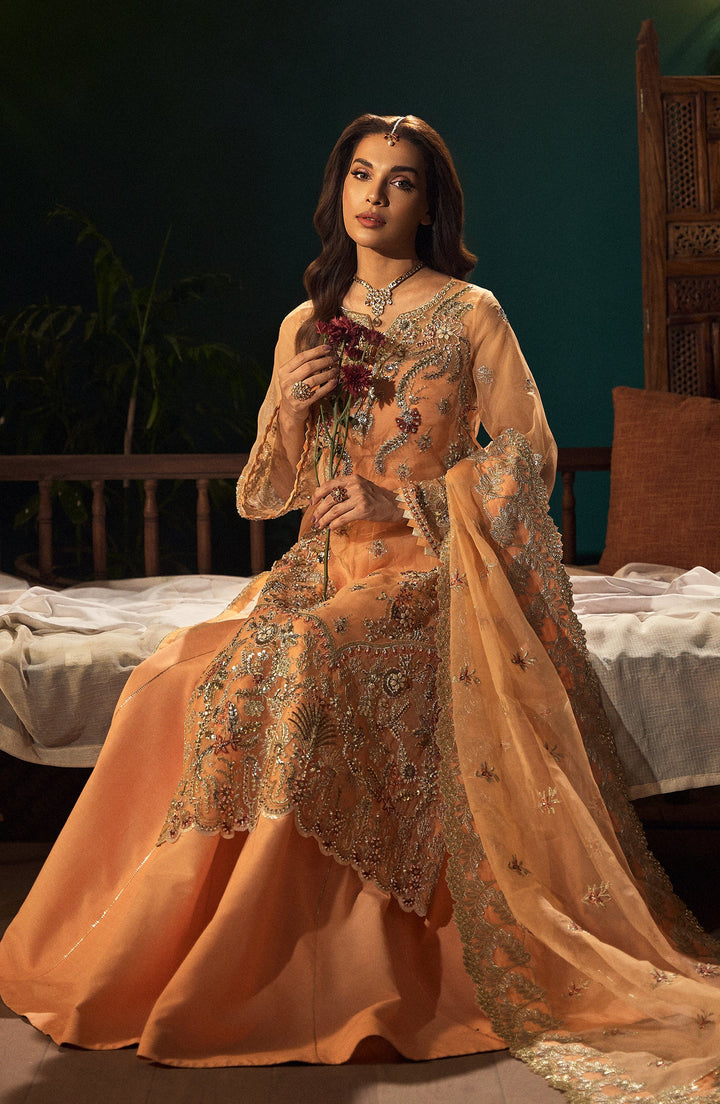 Morganite peach dress worn in a garden setting, featuring pastel tones and a flowing silhouette for timeless elegance | fabiha fatima