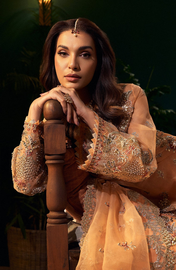 Morganite peach evening dress with a high-waist design and cascading skirt for a graceful silhouette